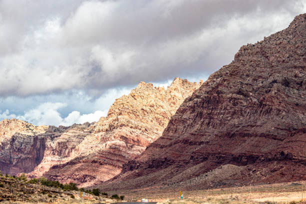 istock Dark clouds gather through the sun near rolling mountains in AZ, USA 1265675131