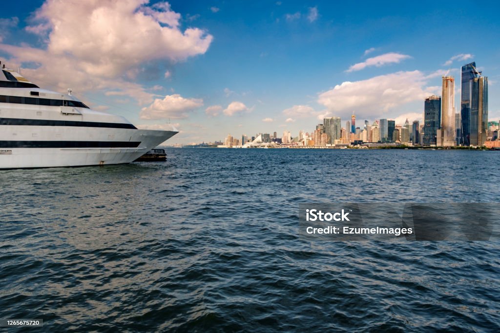 Cruise Ship NYC Skyline Cruise ship NYC skyline against summer blue sky Hudson - New York State Stock Photo