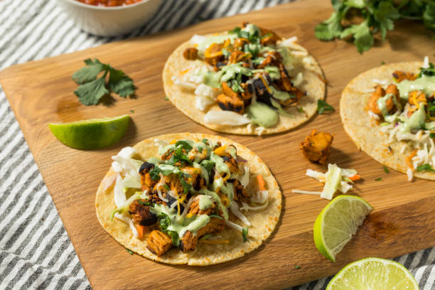 Homemade Chicken Meixcan Street Tacos Homemade Chicken Meixcan Street Tacos with Cheese and Crema fresh cilantro stock pictures, royalty-free photos & images