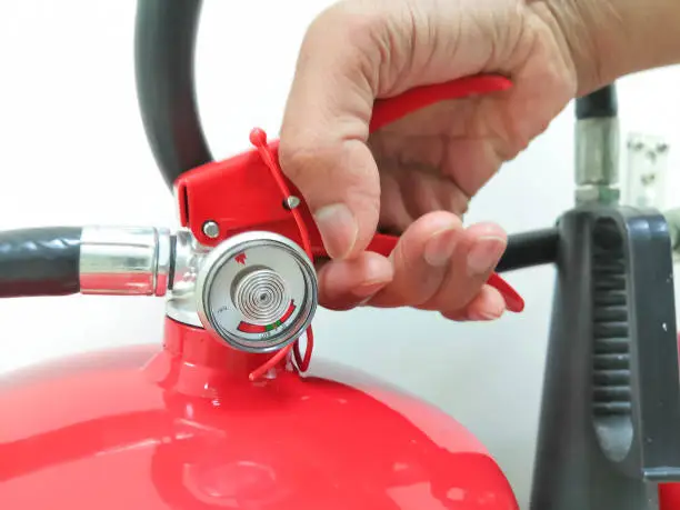 Closeup Image Of Holding Fire Extinguisher
