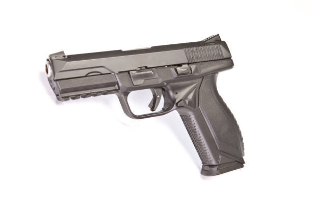 istock Silver and dark grey pistol on a white background. 1265680065