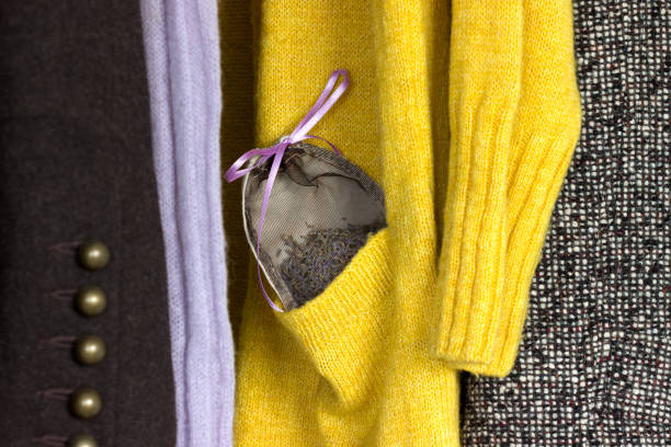 Lavender sachet in a woolen jacket pocket in a closet, moth repellent.