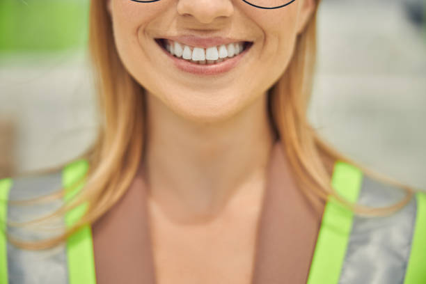 istock Merry female worker dressed in a reflective waistcoat 1265683574