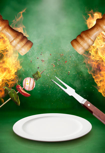 Barbecue hot and spicy barbecue scene with green background salt pepper ingredient black peppercorn stock pictures, royalty-free photos & images