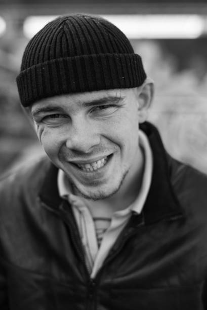 istock Bully criminal in black leather jacket. Black and white photo 1265687970