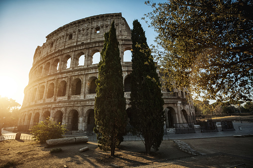 The Coliseum icon of Rome in a  summer warm dawn: vacations in Italy
