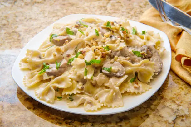 Goat cheese mushroom stroganoff with chopped walnuts