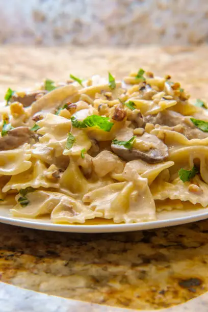 Goat cheese mushroom stroganoff with chopped walnuts