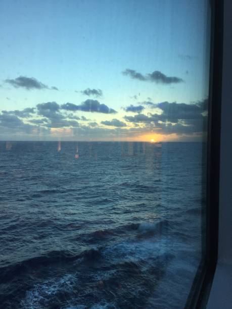 istock Window view of open ocean seascape at sunset 1265690949