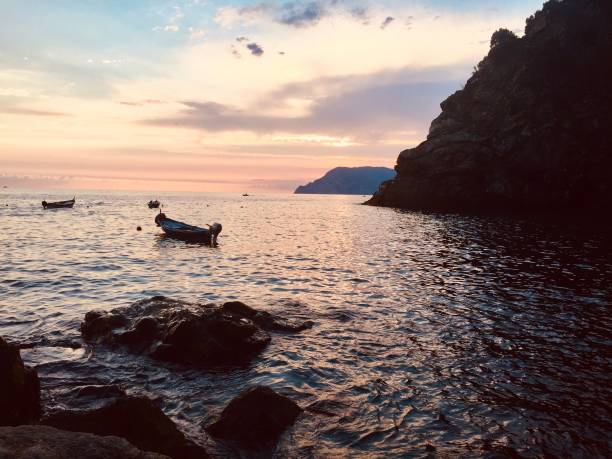 istock Corniglia Bay Sunset with boats, Cinque Terre, Italy 1265692011