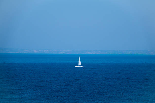 istock luxury big sailing boat at the horizon on open sea. 1265692026
