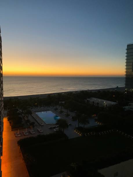 istock Balcony view of poolside lounge near beach shoreline 1265696341