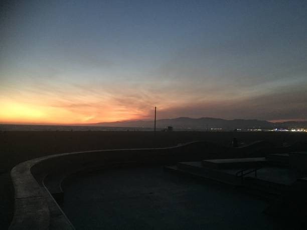 istock Landscape view of distant mountain city at sunset 1265696962