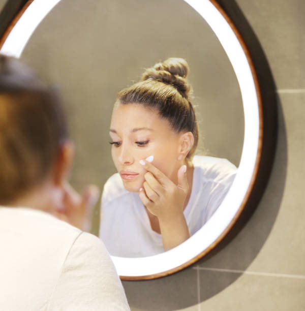 istock Magic anti-aging cream.Applying the cream 1265696991
