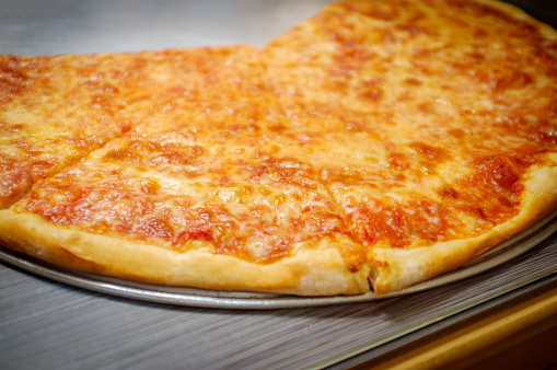 Large slices of cheese pizza New York style