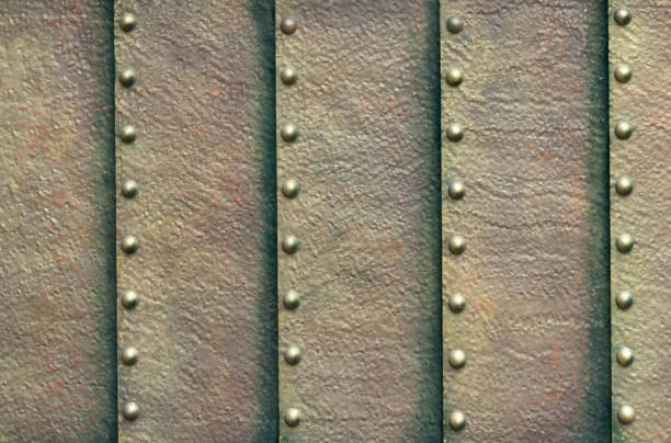 istock Grunge metal striped texture with rivets 1265702551