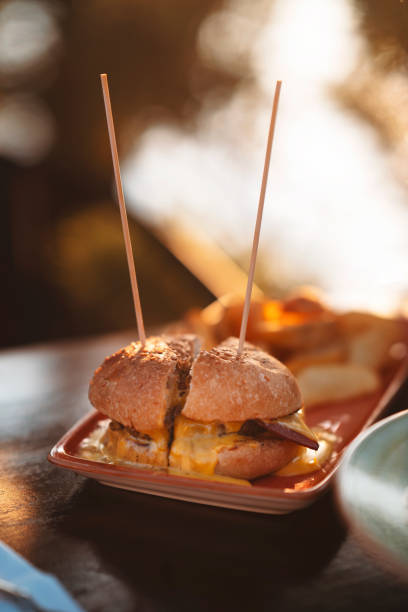 istock Delicious hamburger, chips and onion rings 1265703154