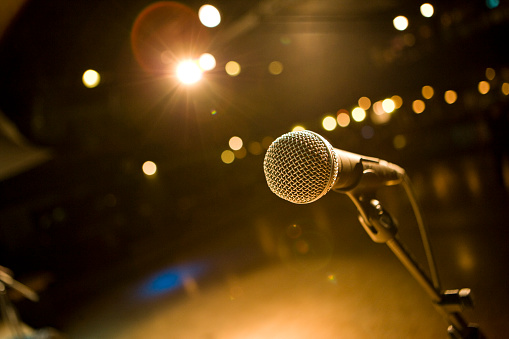 Close-up of microphone in concert hall or stand up club