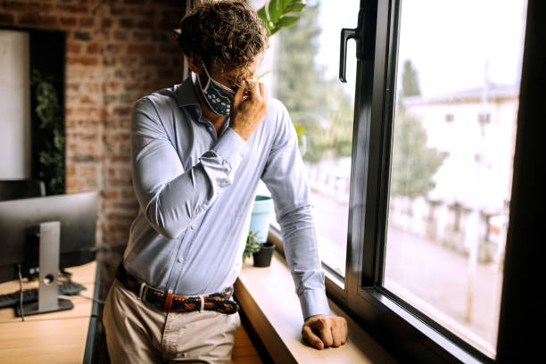 istock Trying to cope with a stress during pandemic at office 1265709991