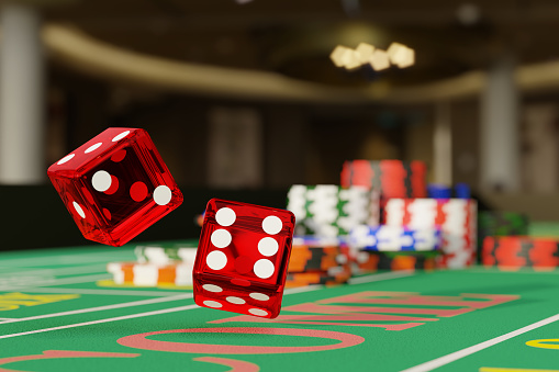 Close up shot of a pair of dice rolling down a craps table. Selective focus.Gambling concept. 3d illustration.