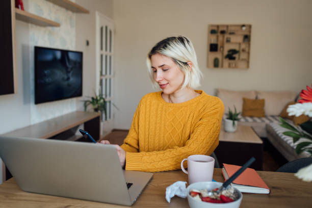 istock Young teacher starting to work from her home office 1265722736