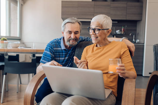 istock senior woman and her husband working together on the computer 1265724226