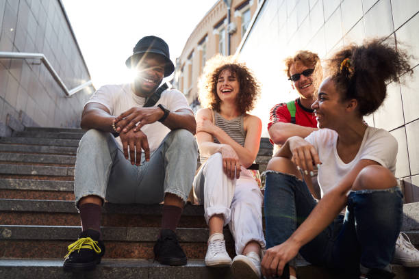 istock Jolly young people communicating in city centre 1265724385