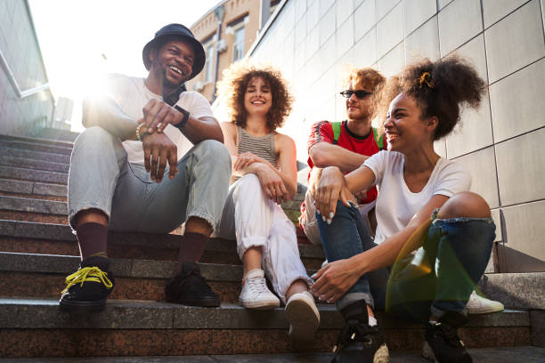 istock Cheerful friends spending sunny day in city 1265724388