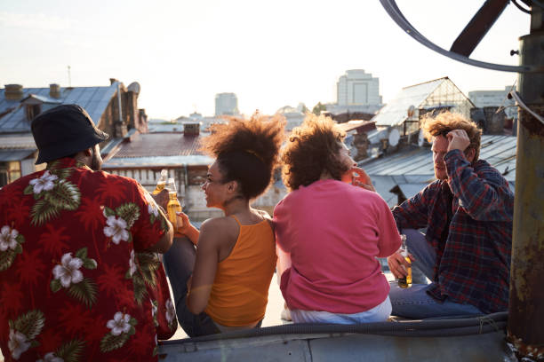 istock Two young couples enjoying double dating on roof 1265724458