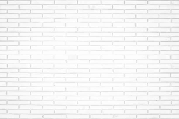 istock White brick wall texture background in room at subway. Brickwork stonework interior, rock old clean concrete grid uneven abstract weathered bricks tile design, horizontal architecture wallpaper. 1265724490