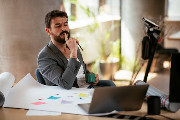 istock Young businessman working with laptop at office. 1265724585