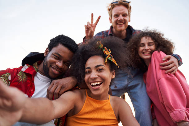 istock Happy friends having fun together in open air 1265726032