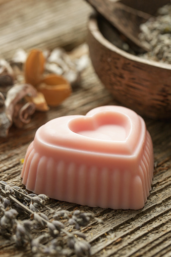 Heart-shaped pink handmade soap with natural ingredients.  Homemade toxic-free natural organic soap bar.
