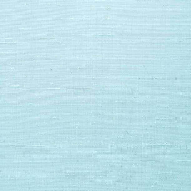 istock Fine natural cotton silk fabric wallpaper texture pattern background in light pastel cyan blue color tone 1265734920