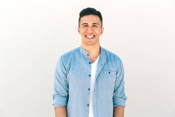 istock Outdoors Leisure. Stylish guy standing isolated on white laughing cheerful to camera 1265735984