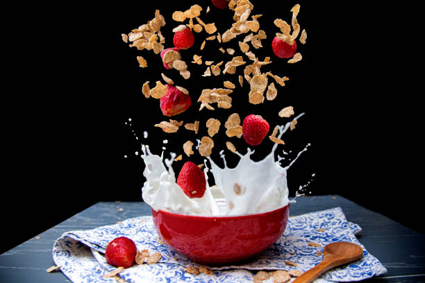 A closeup of colorful granola on creamy yogurt, ideal for a nutritious breakfast
