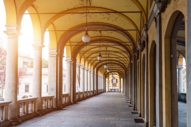 istock Italy, Novara. Yellow arches with white columns.  Toning. 1265740941