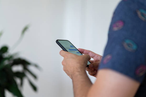 istock Close up of a man using cellphone 1265743440