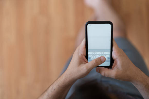 istock Close up of a man using cellphone 1265743948
