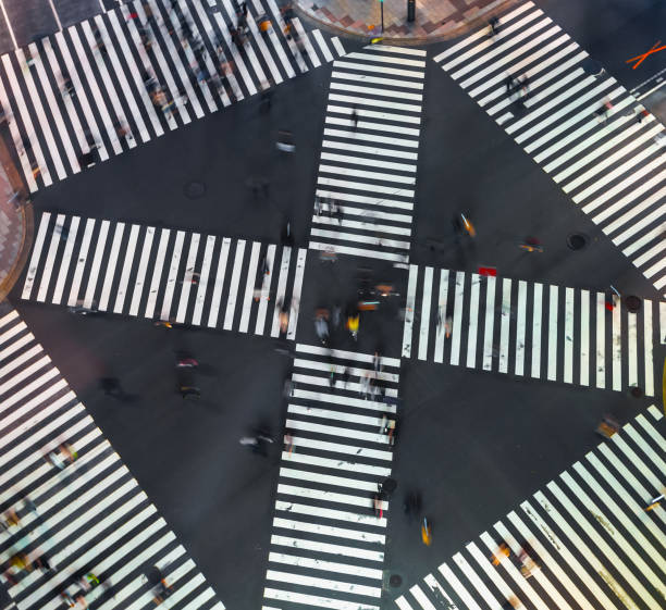 istock Traffic and people cross a busy intersection in Ginza 1265759536