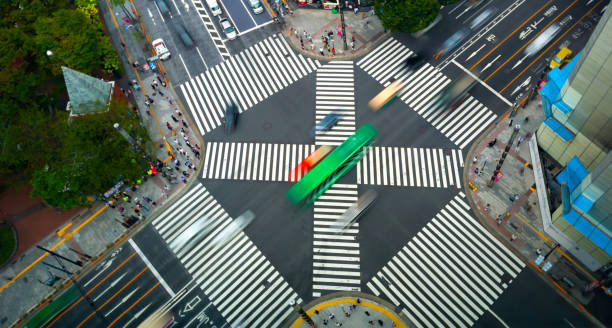 istock Traffic and people cross a busy intersection in Ginza 1265759539