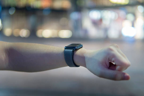 istock A young man hand using a smart watch at night in the outdoors 1265785391