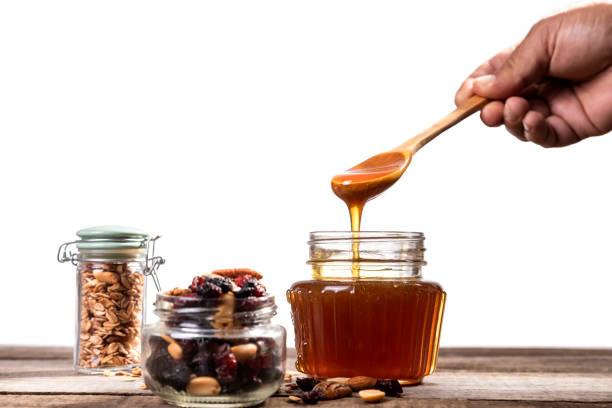 istock delicious honey with oatmeal and granola 1265788464
