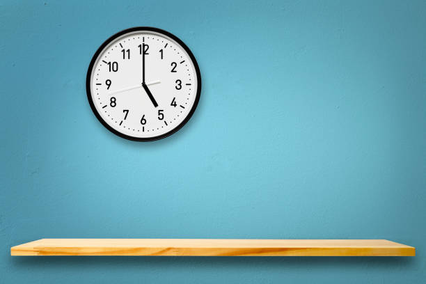 istock Wall clock above the wooden shelf 1265796870