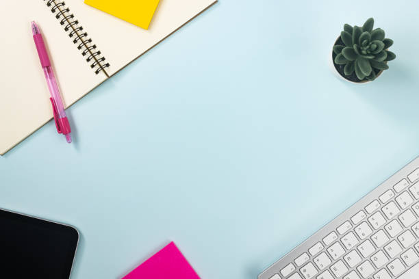 istock Minimalist Background and Spiral Notebook or Spring Notebook with Stationery on Pastel Background 1265809880