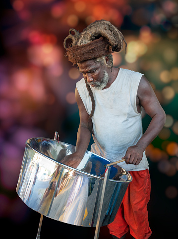 Republic of Trinidad and Tobago - January 01, 2012: Caribbean metal steel drum played by a musician in the republic of Trinidad and Tobago.