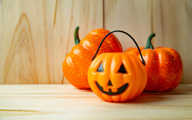 istock pumpkin jack o lantern on wood for  halloween content. 1265829193
