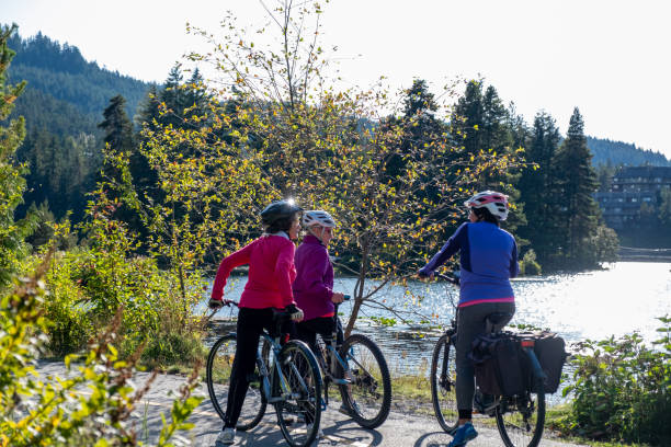 istock Three active seniors enjoy riding their bicycles 1265851207