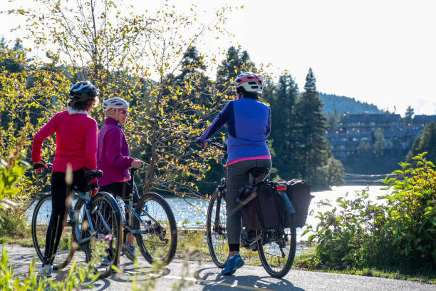 istock Active seniors cycling on a paved trail 1265851716