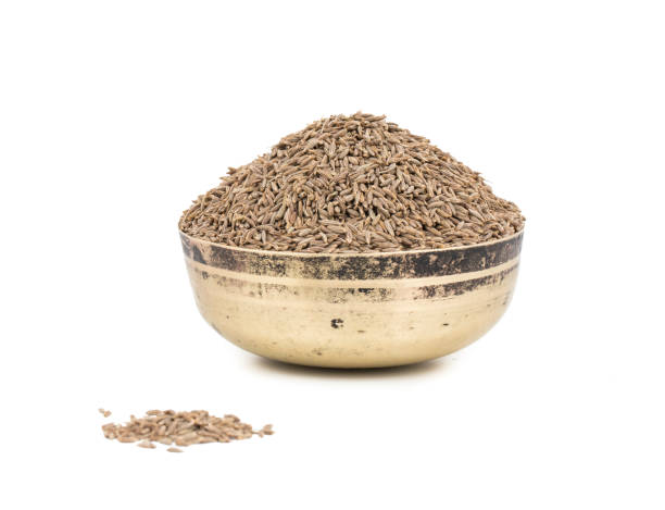 istock Pile of Dried Cumin Seeds on white Background 1265856125